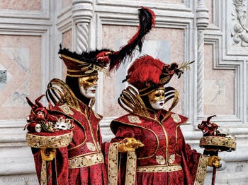 The parade of people in costume at the 2026 Venice Carnival in front of the Church of San Zaccaria.