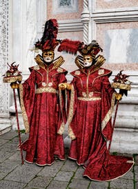 The parade of people in costume at the 2026 Venice Carnival in front of the Church of San Zaccaria.