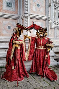 The parade of people in costume at the 2026 Venice Carnival in front of the Church of San Zaccaria.