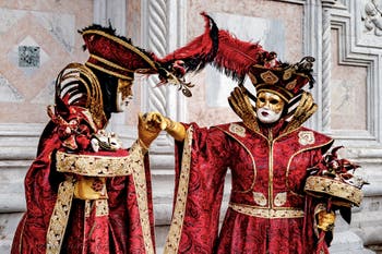 The parade of people in costume at the 2026 Venice Carnival in front of the Church of San Zaccaria.