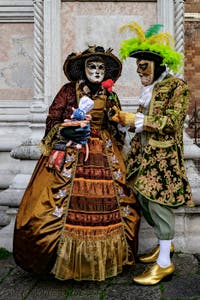 The parade of people in costume at the 2026 Venice Carnival in front of the Church of San Zaccaria.