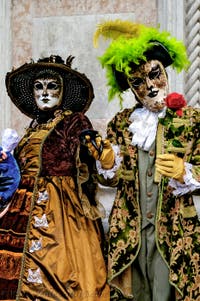 The parade of people in costume at the 2026 Venice Carnival in front of the Church of San Zaccaria.