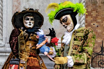 The parade of people in costume at the 2026 Venice Carnival in front of the Church of San Zaccaria.