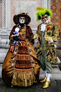 The parade of people in costume at the 2026 Venice Carnival in front of the Church of San Zaccaria.