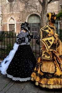 The parade of people in costume at the 2026 Venice Carnival in front of the Church of San Zaccaria.