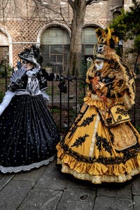 The parade of people in costume at the 2026 Venice Carnival in front of the Church of San Zaccaria.