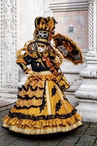 The parade of people in costume at the 2026 Venice Carnival in front of the Church of San Zaccaria.