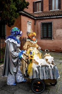 The parade of people in costume at the 2026 Venice Carnival in front of the Church of San Zaccaria.