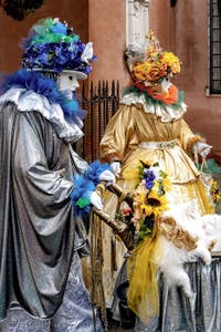 The parade of people in costume at the 2026 Venice Carnival in front of the Church of San Zaccaria.