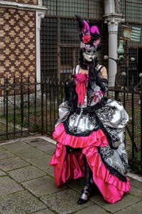 The parade of people in costume at the 2026 Venice Carnival in front of the Church of San Zaccaria.