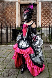 The parade of people in costume at the 2026 Venice Carnival in front of the Church of San Zaccaria.