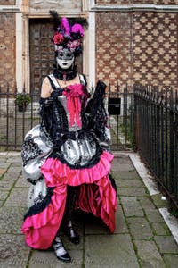 The parade of people in costume at the 2026 Venice Carnival in front of the Church of San Zaccaria.