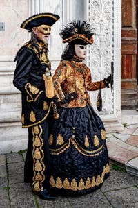 The parade of people in costume at the 2026 Venice Carnival in front of the Church of San Zaccaria.