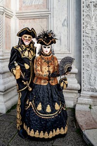 The parade of people in costume at the 2026 Venice Carnival in front of the Church of San Zaccaria.