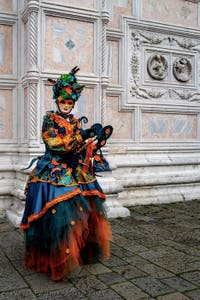 The parade of people in costume at the 2026 Venice Carnival in front of the Church of San Zaccaria.