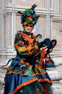 The parade of people in costume at the 2026 Venice Carnival in front of the Church of San Zaccaria.