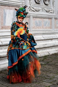The parade of people in costume at the 2026 Venice Carnival in front of the Church of San Zaccaria.