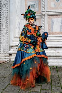The parade of people in costume at the 2026 Venice Carnival in front of the Church of San Zaccaria.