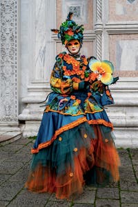 The parade of people in costume at the 2026 Venice Carnival in front of the Church of San Zaccaria.