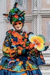 The parade of people in costume at the 2026 Venice Carnival in front of the Church of San Zaccaria.