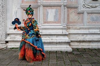 The parade of people in costume at the 2026 Venice Carnival in front of the Church of San Zaccaria.
