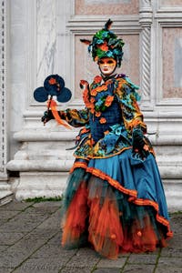 The parade of people in costume at the 2026 Venice Carnival in front of the Church of San Zaccaria.