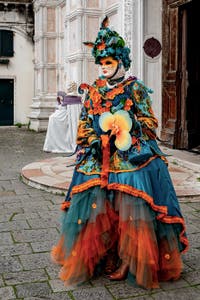 The parade of people in costume at the 2026 Venice Carnival in front of the Church of San Zaccaria.