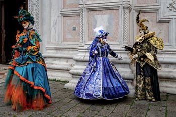 The parade of people in costume at the 2026 Venice Carnival in front of the Church of San Zaccaria.