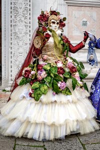 The parade of people in costume at the 2026 Venice Carnival in front of the Church of San Zaccaria.