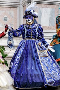The parade of people in costume at the 2026 Venice Carnival in front of the Church of San Zaccaria.