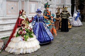 The parade of people in costume at the 2026 Venice Carnival in front of the Church of San Zaccaria.