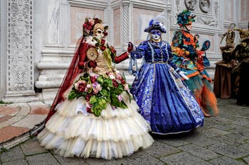 The parade of people in costume at the 2026 Venice Carnival in front of the Church of San Zaccaria.