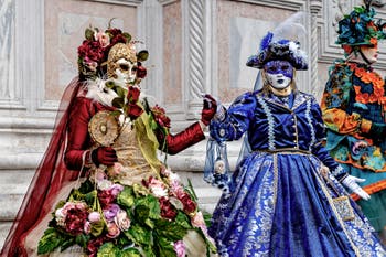 The parade of people in costume at the 2026 Venice Carnival in front of the Church of San Zaccaria.