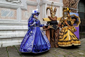 The parade of people in costume at the 2026 Venice Carnival in front of the Church of San Zaccaria.