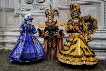 The parade of people in costume at the 2026 Venice Carnival in front of the Church of San Zaccaria.