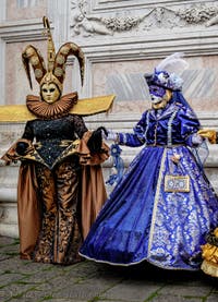 The parade of people in costume at the 2026 Venice Carnival in front of the Church of San Zaccaria.