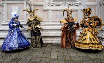 The parade of people in costume at the 2026 Venice Carnival in front of the Church of San Zaccaria.