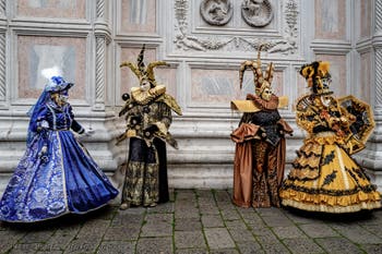 The parade of people in costume at the 2026 Venice Carnival in front of the Church of San Zaccaria.
