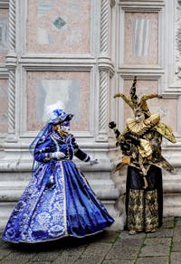The parade of people in costume at the 2026 Venice Carnival in front of the Church of San Zaccaria.