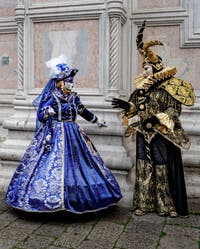 The parade of people in costume at the 2026 Venice Carnival in front of the Church of San Zaccaria.