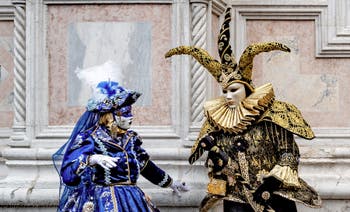 The parade of people in costume at the 2026 Venice Carnival in front of the Church of San Zaccaria.