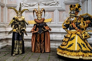 Venice carnival costumed figures