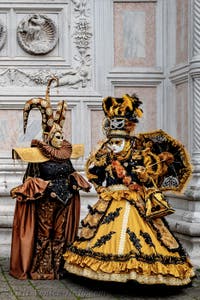 The parade of people in costume at the 2026 Venice Carnival in front of the Church of San Zaccaria.