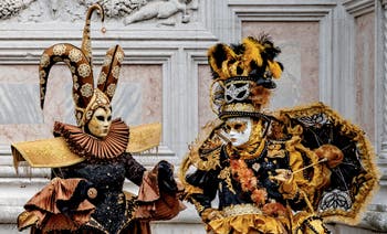 The parade of people in costume at the 2026 Venice Carnival in front of the Church of San Zaccaria.