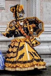 The parade of people in costume at the 2026 Venice Carnival in front of the Church of San Zaccaria.