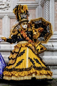 The parade of people in costume at the 2026 Venice Carnival in front of the Church of San Zaccaria.