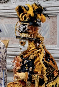 The parade of people in costume at the 2026 Venice Carnival in front of the Church of San Zaccaria.