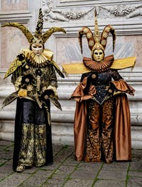 The parade of people in costume at the 2026 Venice Carnival in front of the Church of San Zaccaria.