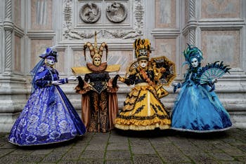 The parade of people in costume at the 2026 Venice Carnival in front of the Church of San Zaccaria.