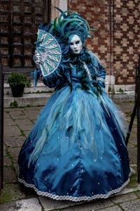 The parade of people in costume at the 2026 Venice Carnival in front of the Church of San Zaccaria.